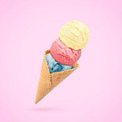 Yummy ice cream served in waffle cone in air on pink background