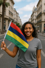 A woman smiles brightly while holding the Mauritian flag in a bustling city street. The surroundings feature beautiful architecture under a clear sky, enhancing the joyful atmosphere