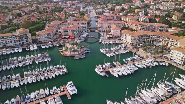 Aerial view of yachts in a marina in Frejus, France shot with a drone