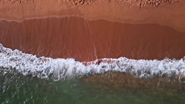 Aerial view of a beach and sea in Frejus, France shot with a drone