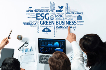 A collaborative team analyzes data related to green business practices, focusing on ESG initiatives that promote environmental sustainability and ethical governance. Amity