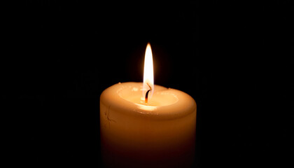 Single white funeral candle glowing in dark room, remembrance concept
