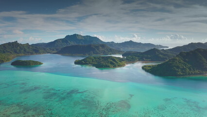 Breathtaking aerial landscape, turquoise ocean water coastline with multiple lush green islands....