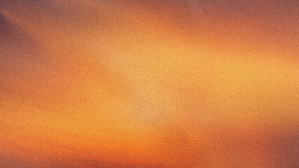 A blurred abstract background showcasing warm hues of orange yellow and subtle hints of purple and brown tones