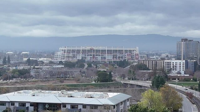Drone shot of San Jose and Santa Clara Freeway and traffic along Levi's Stadium during daytime, USA