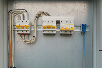 Close up of circuit breakers with wires inside the electrical panel for protection an electrical circuit from damage