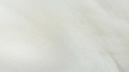 A softly blurred image showing a neutral background with subtle color variations and gentle gradations
