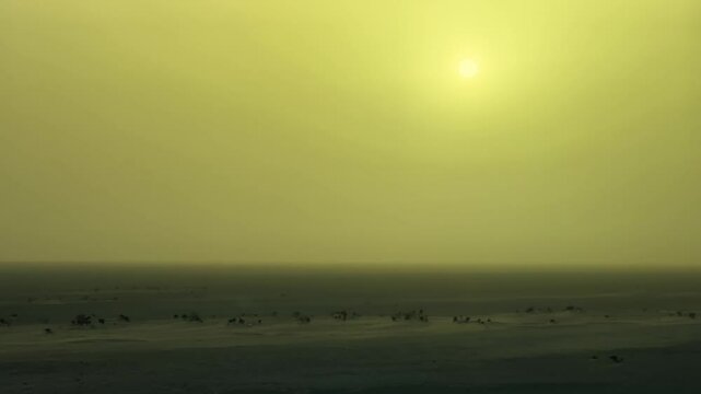 Serene sunrise over the Sahara Desert showcasing vast landscapes
