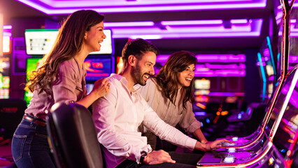 Group of Friends Enjoying Slot Machines in a Vibrant Casino Setting