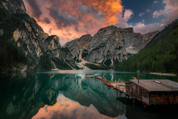 Lago di Braies, Pragser Wildsee. Beautiful sunset with clouds in Dolomites mountains. Epic blue lake, mountain, cliffs, rocks, forest. Premium landscape from pure nature, Dolomiti, Alps, Italy