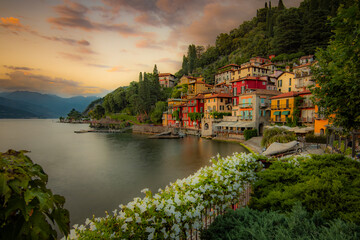 Varenna village. Beautiful sunset with clouds in Alps mountains. Epic blue lake near Milan, mountain, villa, forest, colorful flowers. Premium landscape from pure nature, Lombardy, Italy