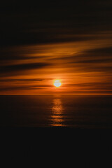 Golden sunset over the Atlantic Ocean at Latrabjarg cliffs, Westfjords Iceland...