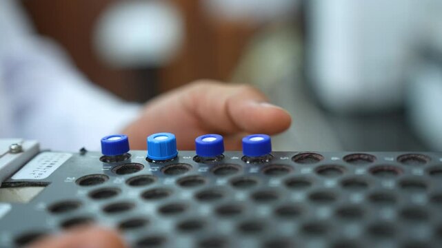 HPLC machine science experiment Vials filling inside an autosampler of an HPLC machine inside view in a Scientific experimental laboratory for research development analysis and ipqa test study	