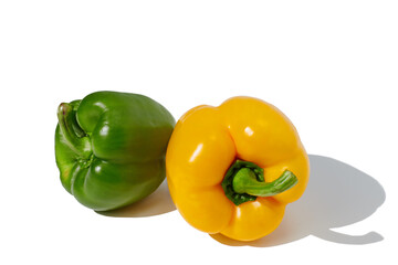 Yellow and green pepper on white background