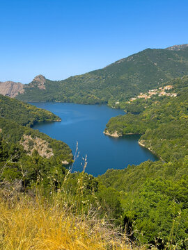 Ocana, Corsica, France - July 8, 2024: Green mountain landscape with the blue Lac de Tolla Lake