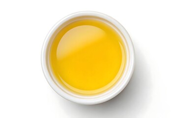 Golden sunlight captured in a small white bowl, a vibrant pool of liquid sunshine ready to enhance any culinary creation.