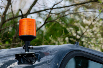 Orange emergency vehicle light signals safety in outdoor setting