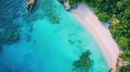 A stunning aerial view of a tropical beach scene, showcasing crystal-clear waters and sandy shores. 