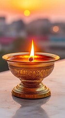A golden lamp glows against a sunset. The cityscape is visible through the out of focus background