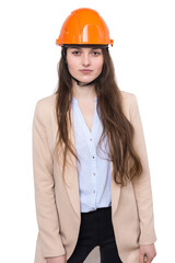A girl architect in a suit and an orange construction helmet stands on a white background.