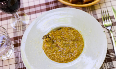 Homemade risotto with mushrooms and vegetables on a plate