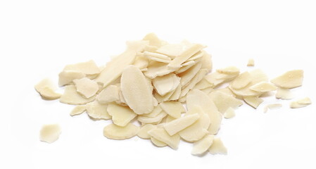 Pile raw almond chopped, sliced isolated on white background, side view