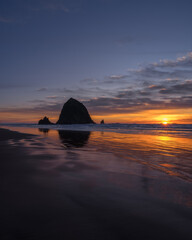 Sunset over Cannon Beach, Oregon, a seaside town know for the Haystack Rock (pictured)