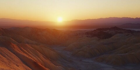 Fototapeta premium Vast desert at sunset with mountains, water body, and unique terrain.
