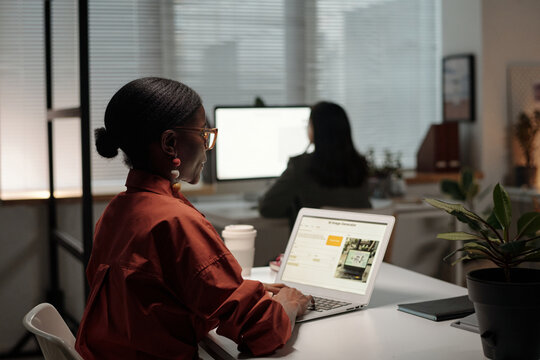 Young Black Woman Working on Presentation on Laptop