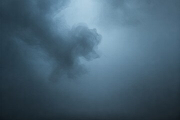 Fototapeta premium Ethereal Mist: Swirling blue smoke creates an abstract, dreamlike atmosphere, capturing a moment of mystery and serene beauty.