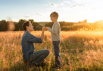Happy father giving son a fist bump. Father son relationship concept
