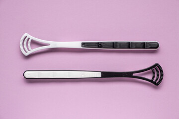 Two tongue brushes. Dental and oral care. Flat lay, top view.