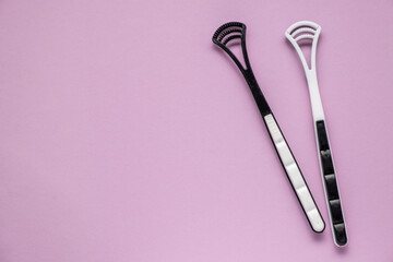 Two tongue brushes. Dental and oral care. Flat lay, top view.
