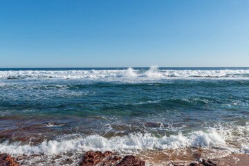 waves breaking over the rocks
