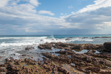 waves breaking over the rocks