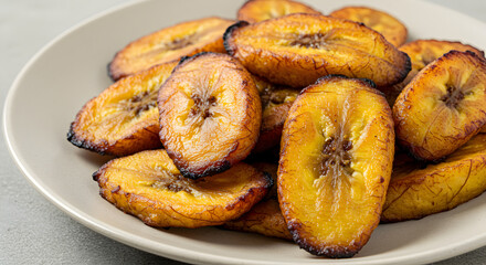 Golden Perfection: A Plateful of Delightful and Crispy Fried Plantains Treat