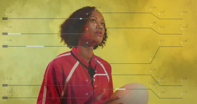 Athlete holding basketball with data processing animation over yellow background - Powered by Adobe