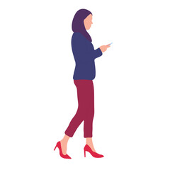 Fototapeta premium Woman in hijab walking and using a phone