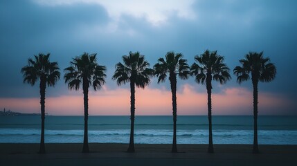 Fototapeta premium Beach sunset with palm trees scenic view ocean waves twilight sky tropical landscape summer vacation 