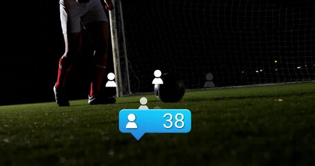Kicking soccer ball, player surrounded by animation of social media icons - Powered by Adobe
