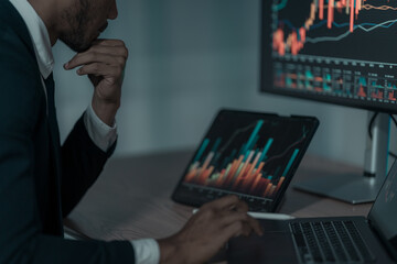 Stock market analyst, data exchange, digital chart on computer screen, thinking about investing,...