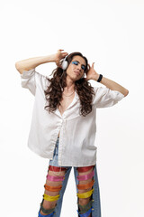 Genderless person listening to music and happy with their pride pants