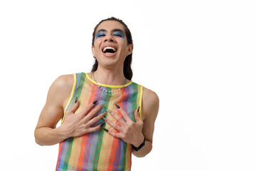 Genderless person wearing pride clothing smiling and posing happily for the camera