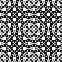Swirl Pattern Background: Abstract Black and White Design. The image displays a seamless pattern of black spiral shapes on a white background.
