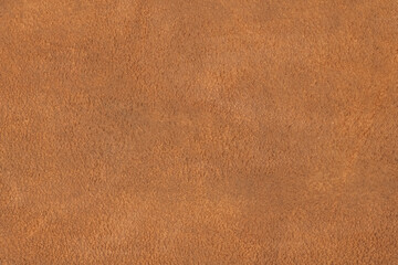 Natural light brown suede texture. Genuine shammy-leather with slight shabby texture, pattern or background, close-up, high resolution.