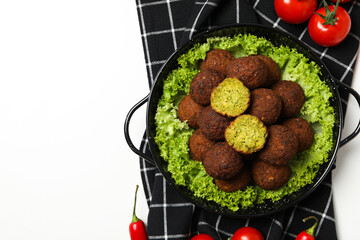 Falafel in a plate, on a light background.