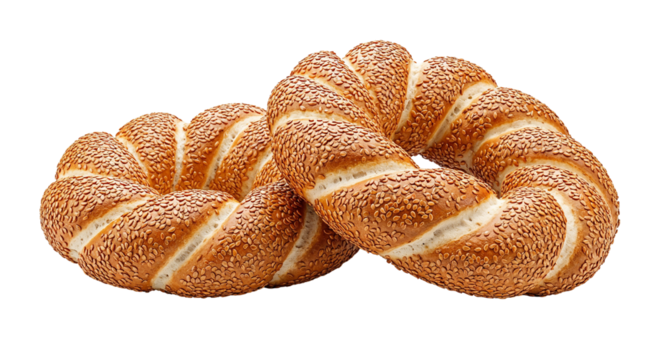 Two freshly baked twisted sesame simit breads with golden crust, isolated on transparent background
