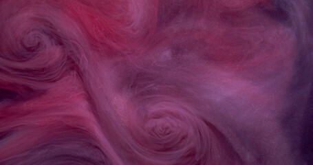 Color vapor. Cloud ink. Defocused purple pink glitter mist water exhaust sparkling texture on art abstract creative dark black background.