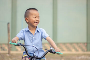 A young boy riding bicycle capture