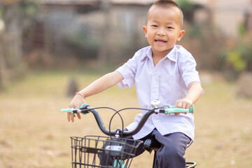 A young boy riding bicycle